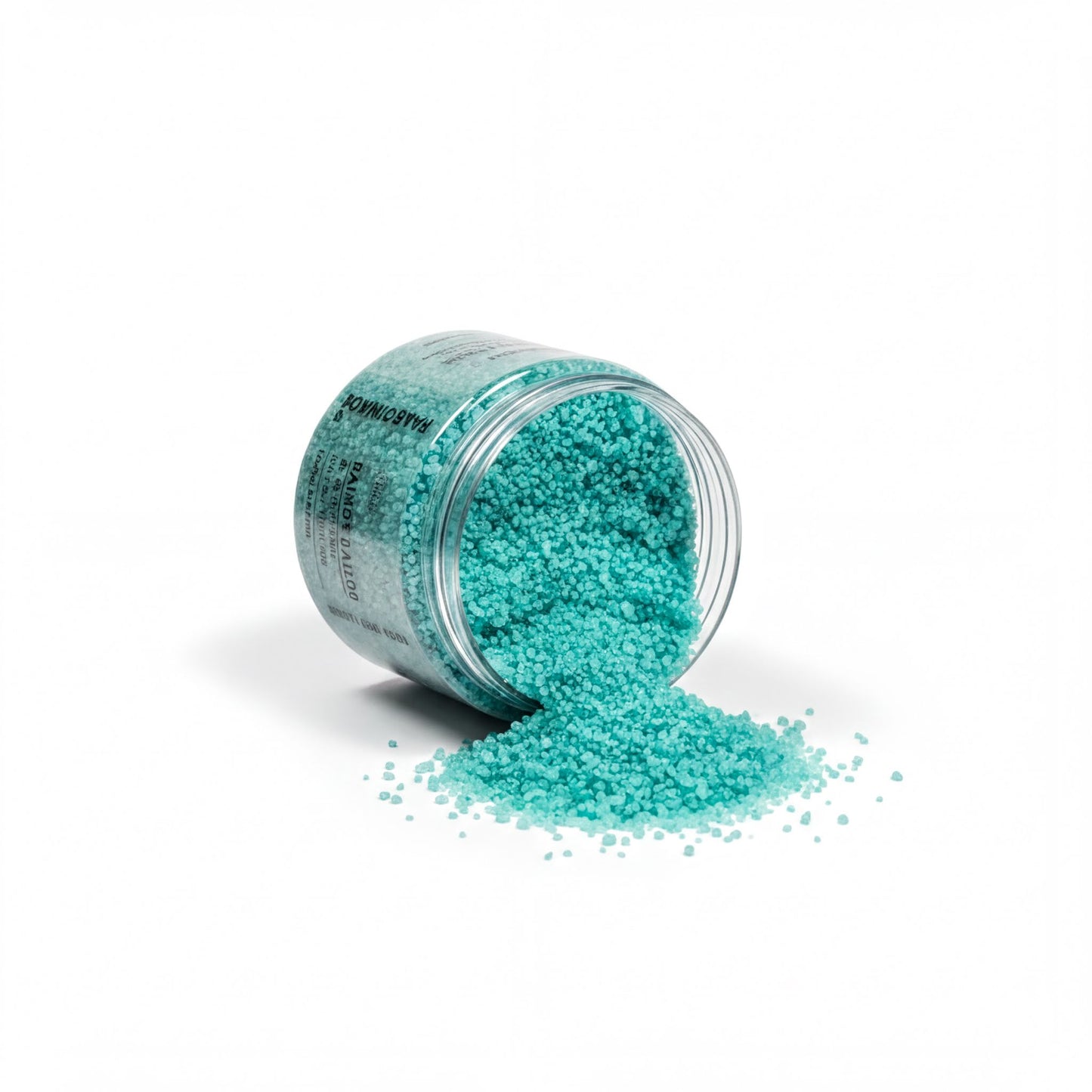 A jar of turquoise-colored bath salt is spilling its contents onto a white surface, creating a visually striking contrast.