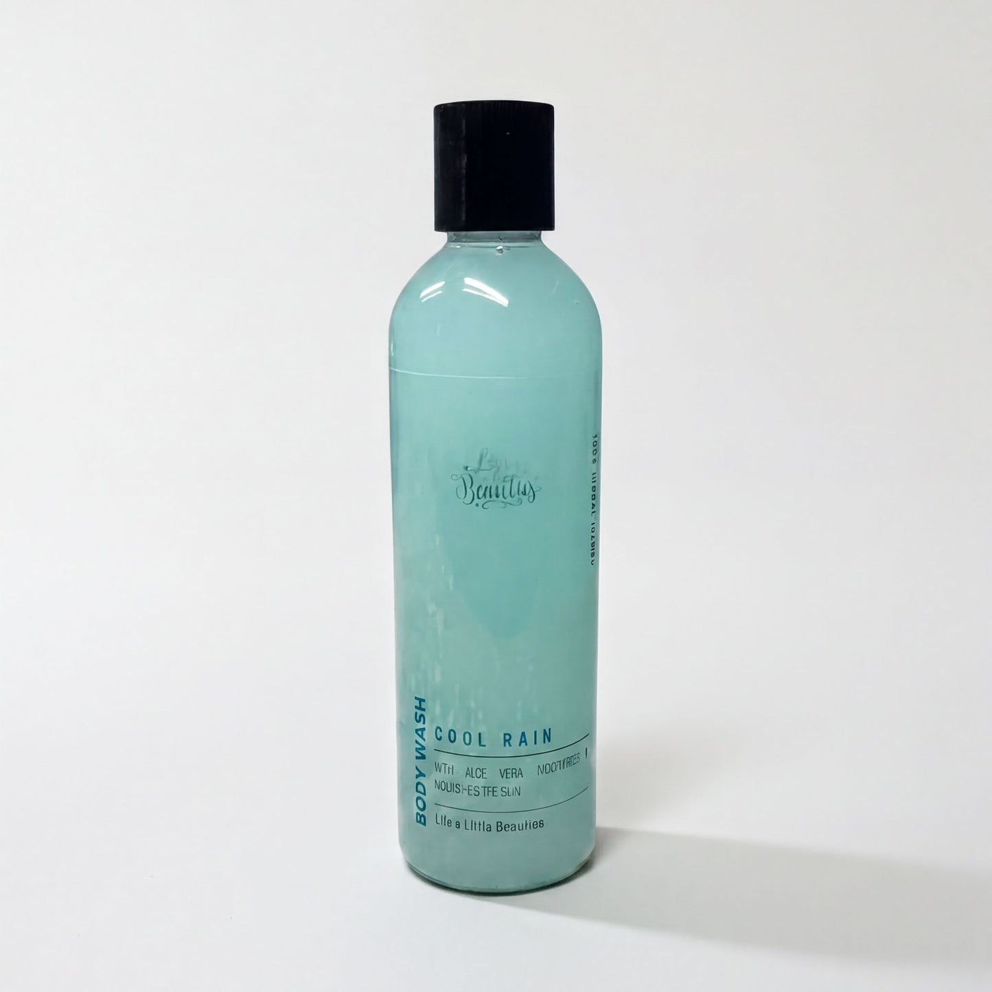 A bottle of body wash with a turquoise color and a black cap, labeled as "Cool Pain".