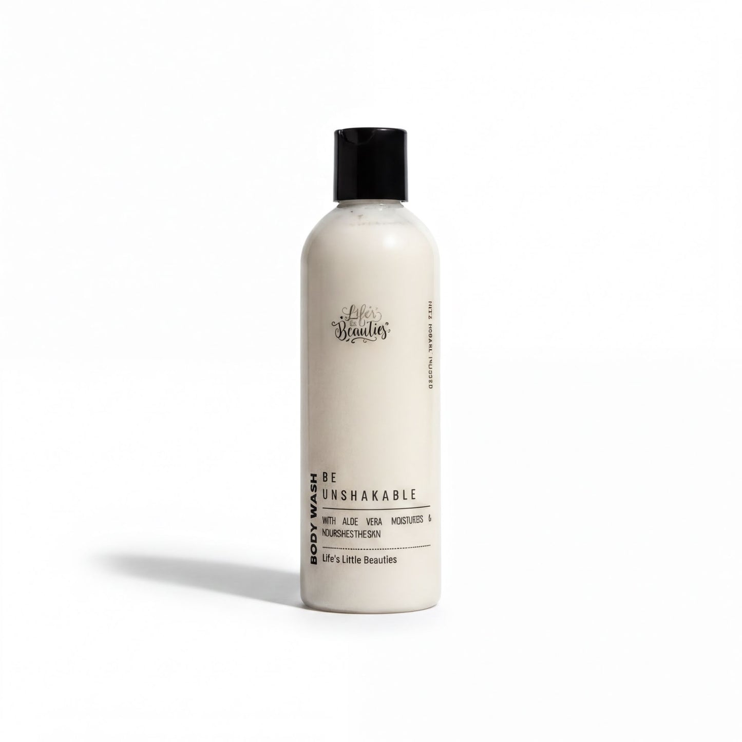 A bottle of body wash with a white label that reads "Be Unbreakable" and "Body Wash with Aloe Vera, Nourishing & Nourishing The Skin".