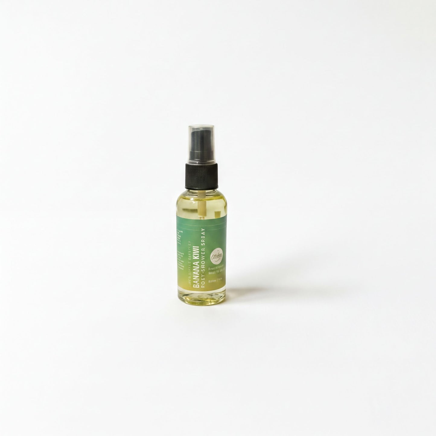 A bottle of liquid with a green label is standing upright on a white background.