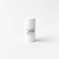 A white deodorant stick with green text and a green design on it.