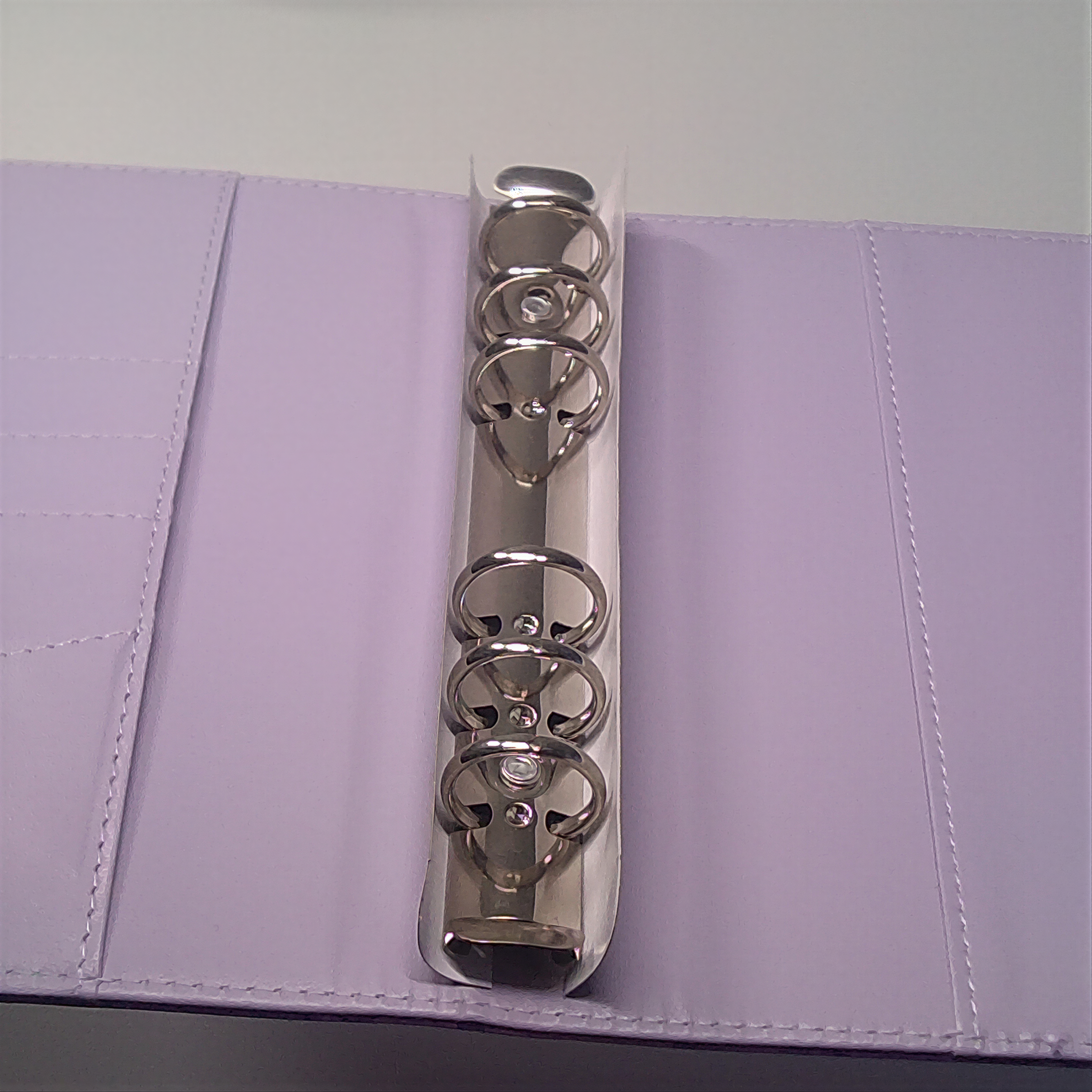 Lavender planner with silver metal rings and stitched binding