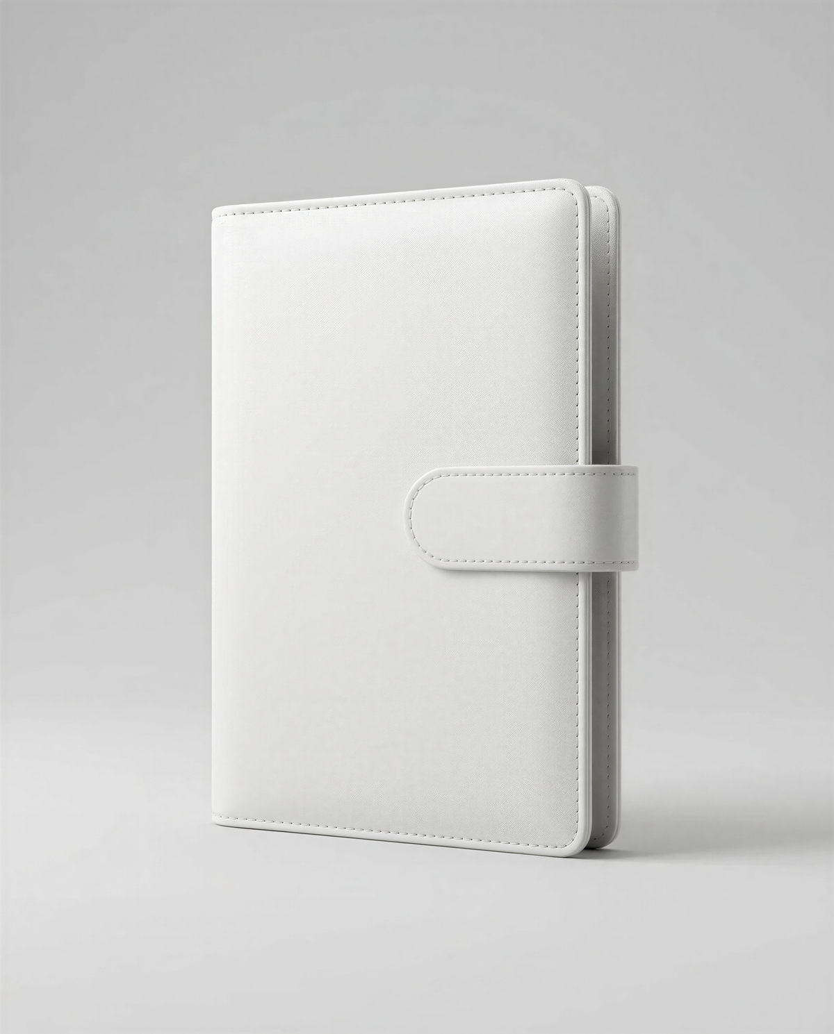 A white leather-bound notebook or binder with a zipper closure and a small leather clip on the front.