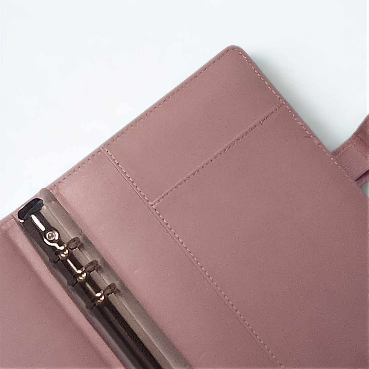Dusty rose leather wallet with silver zipper and stitching detail