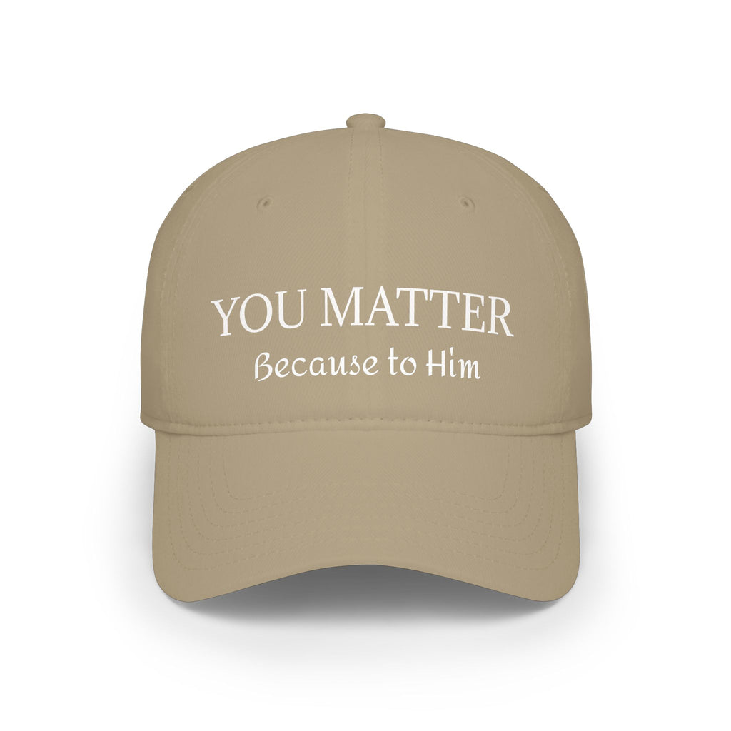 Tan baseball cap with 'YOU MATTER Because to Him' text in white lettering