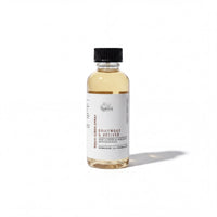 A bottle of Driftwood & Meilver essential oil spray against a white background.