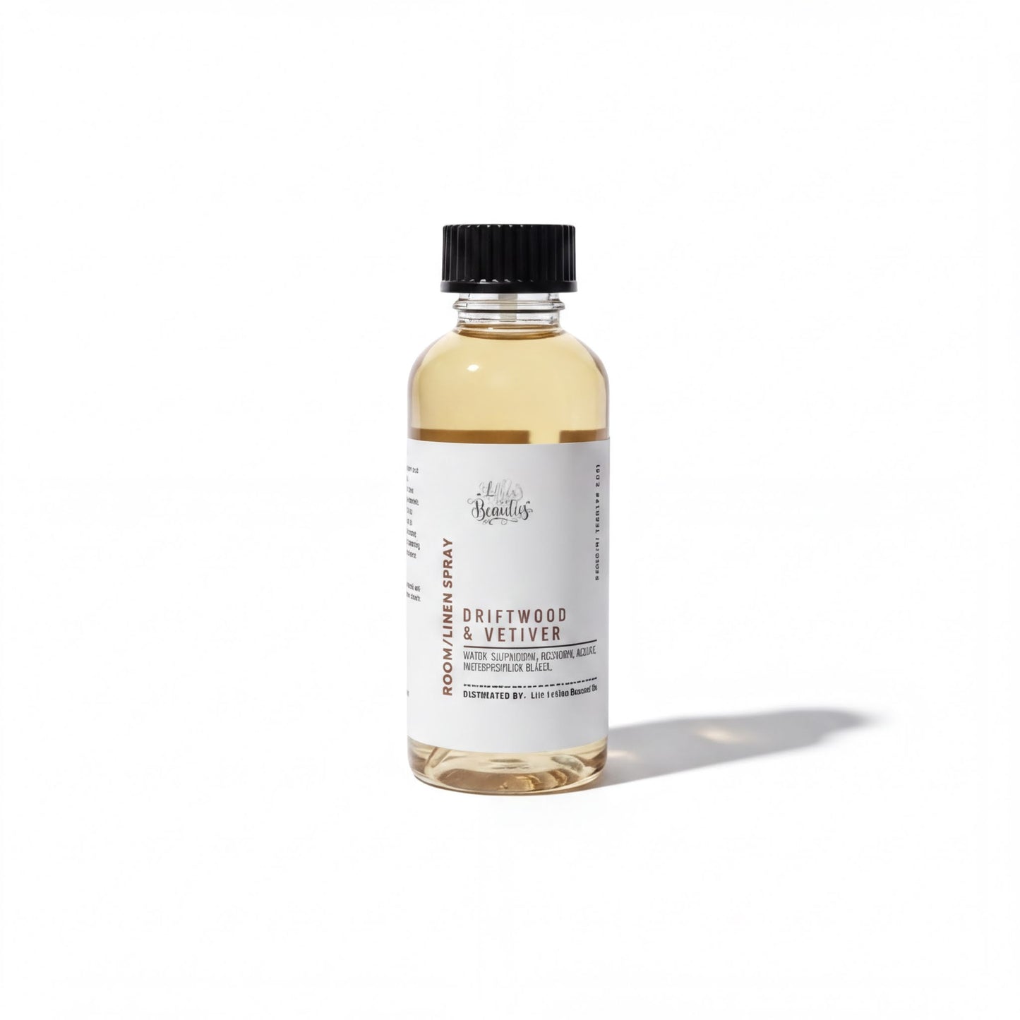 A bottle of Driftwood & Meilver essential oil spray against a white background.