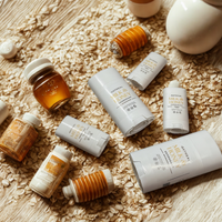 various personal care products, including deodorants, lotions, and a jar of honey, arranged on a wooden surface.