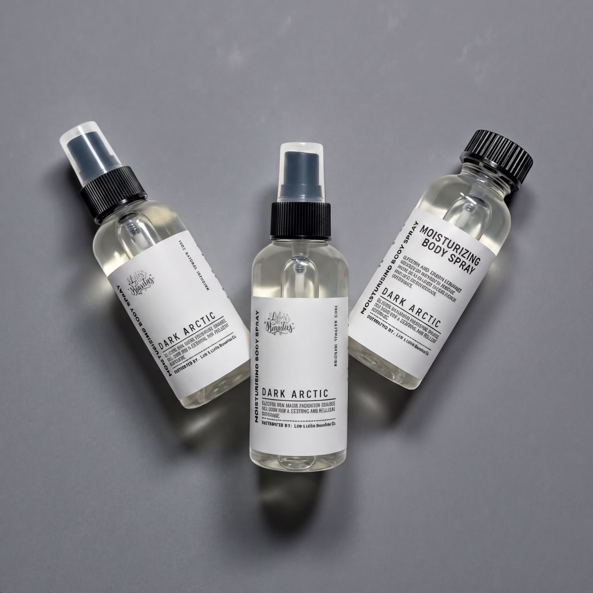 Three bottles of dark arctic body spray are arranged on a gray background.