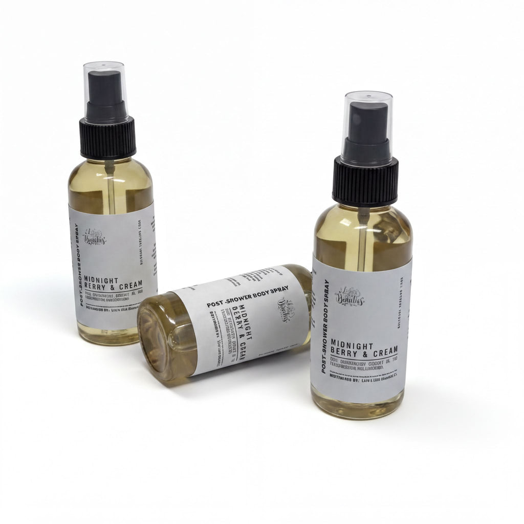 three bottles of body spray with labels that describe the contents as "Midnight Berry & Cream" and "Midnight Berry & Cream".