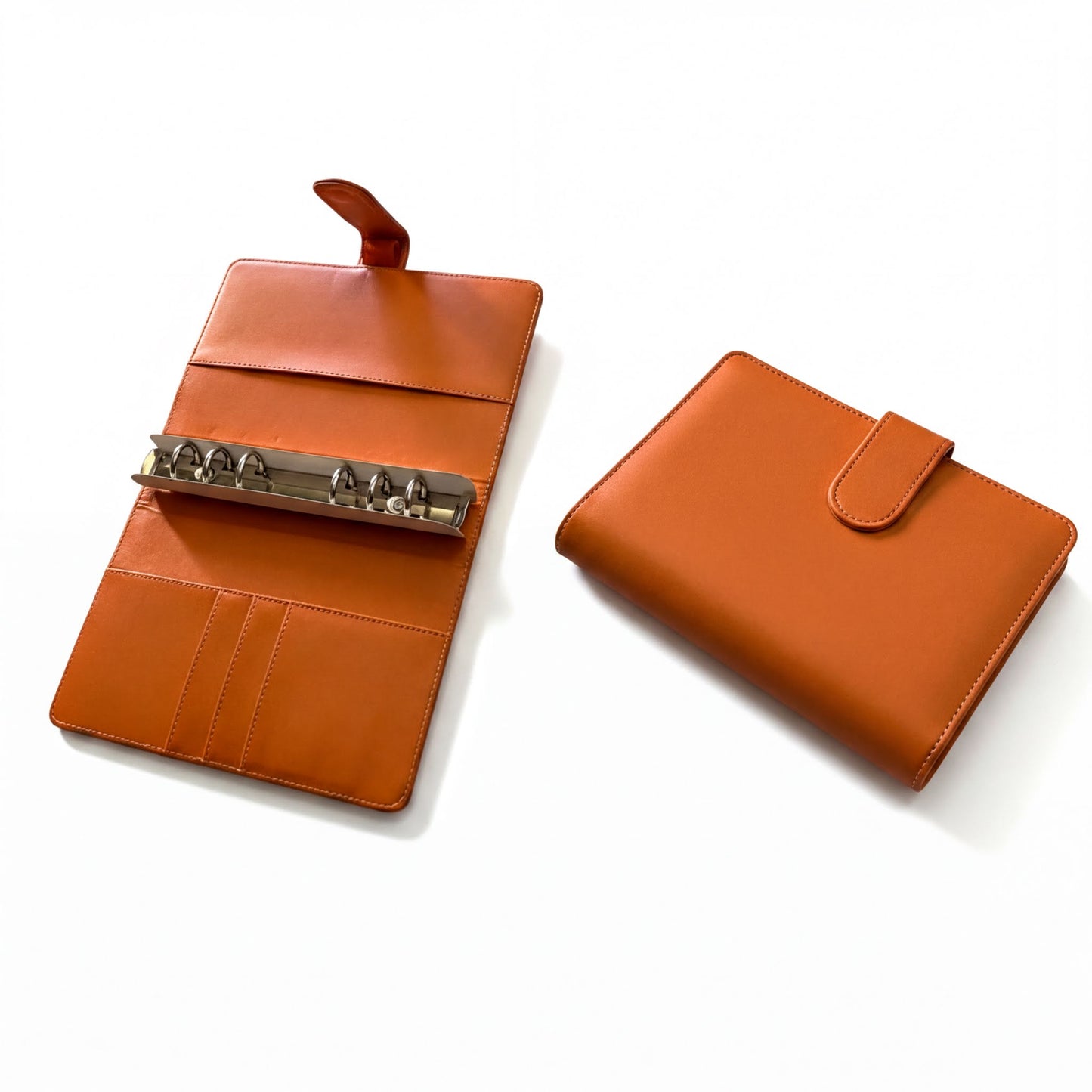 two leather wallets or purses, one open and the other closed, both in an orange color.