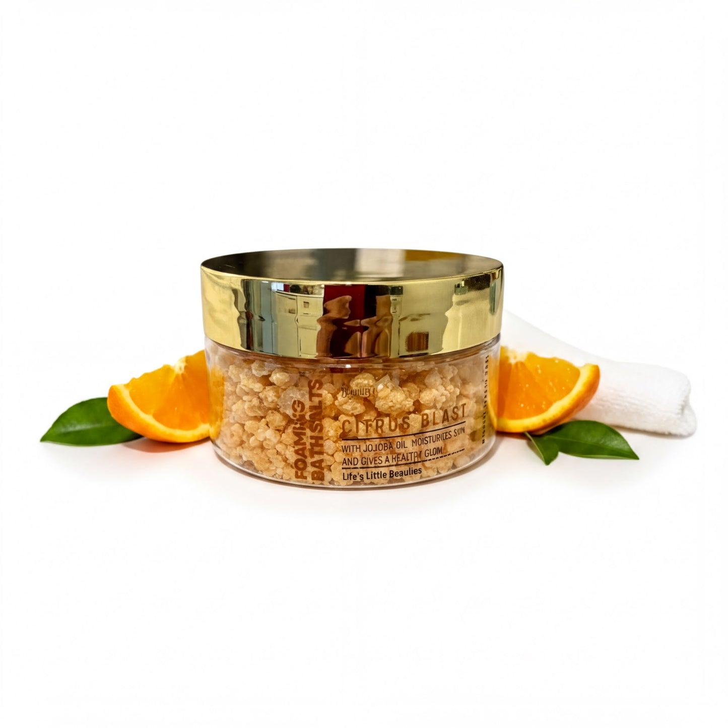 A jar of citrus blast with orange and green leaves, placed on a white surface.