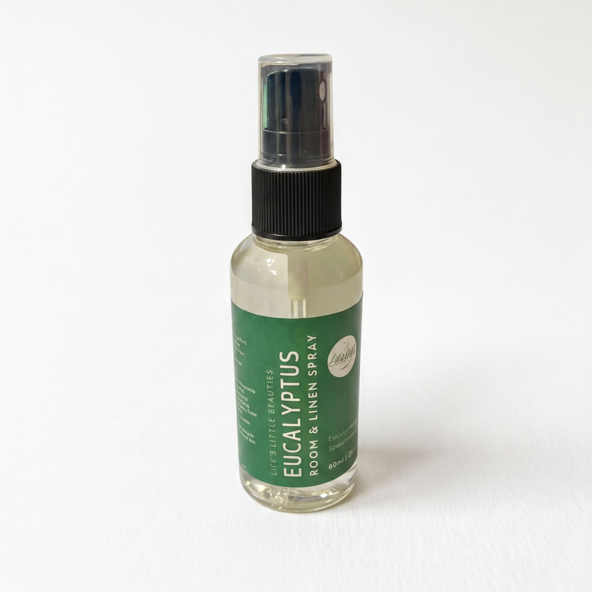 A bottle of eucalyptus essential oil spray is shown against a white background.