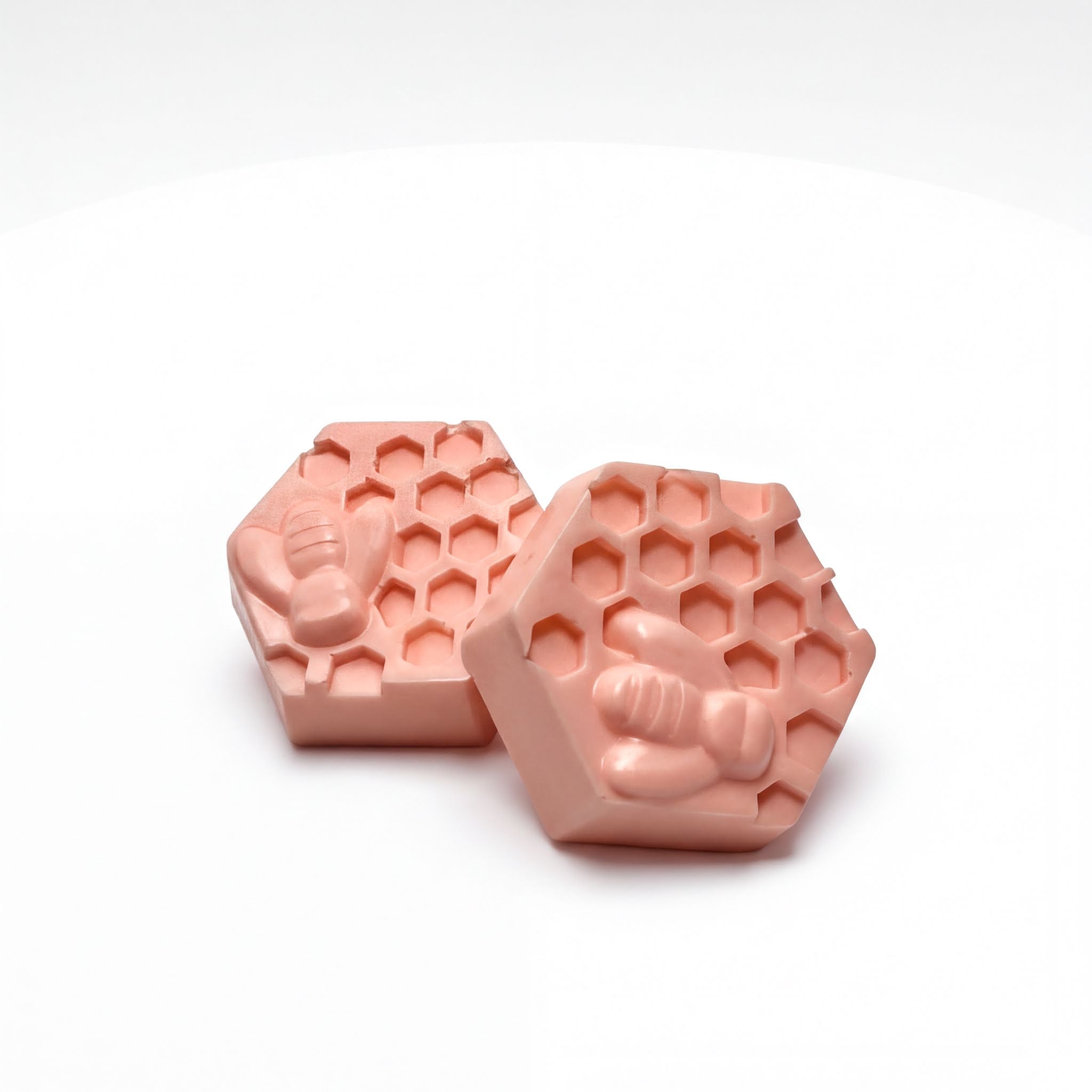 Pink hexagon goat milk soap bars with honeycomb and bee design, natural handmade beauty