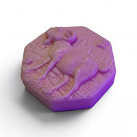 a purple, octagonal soap with a detailed design of a ram or ram-like animal on it.