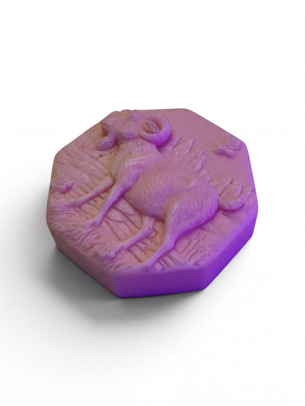 a purple, octagonal soap with a detailed design of a ram or ram-like animal on it.