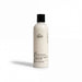 A bottle of body wash with a white label that reads 