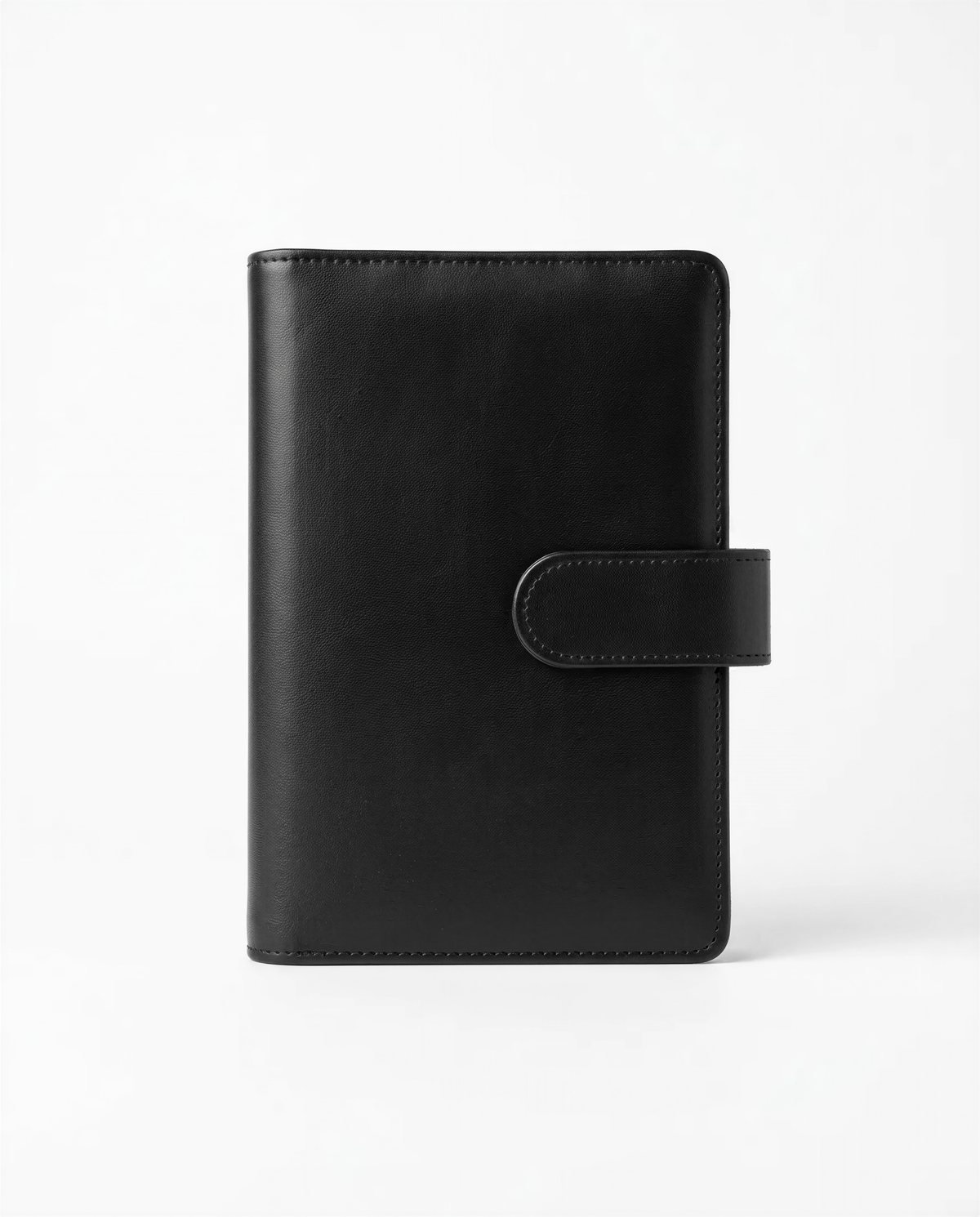 A black leather-bound notebook or journal with a flap closure and a small pocket on the front.