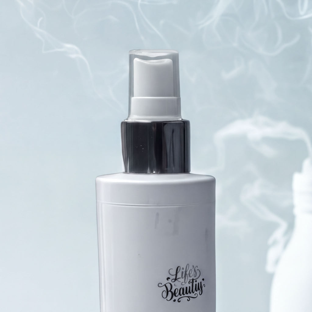 Natural oil spray with goat milk, handcrafted for gentle skincare, featuring a sleek white bottle and misting nozzle.