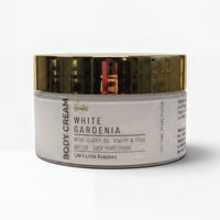 A jar of body cream with a white and gold color scheme.