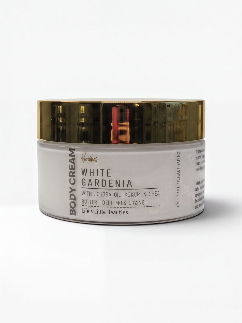 A jar of body cream with a white and gold color scheme.