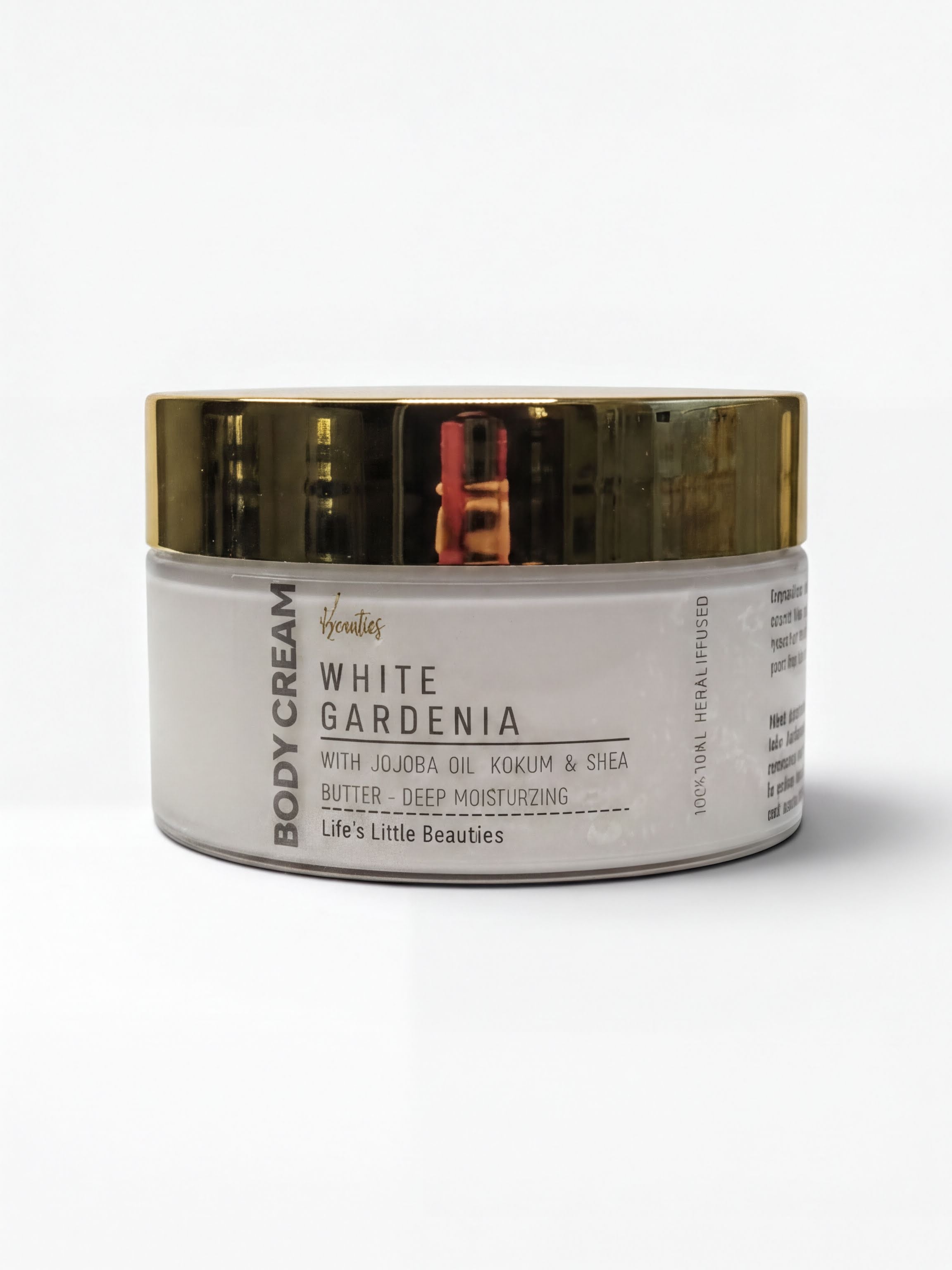 A jar of body cream with a white and gold color scheme.