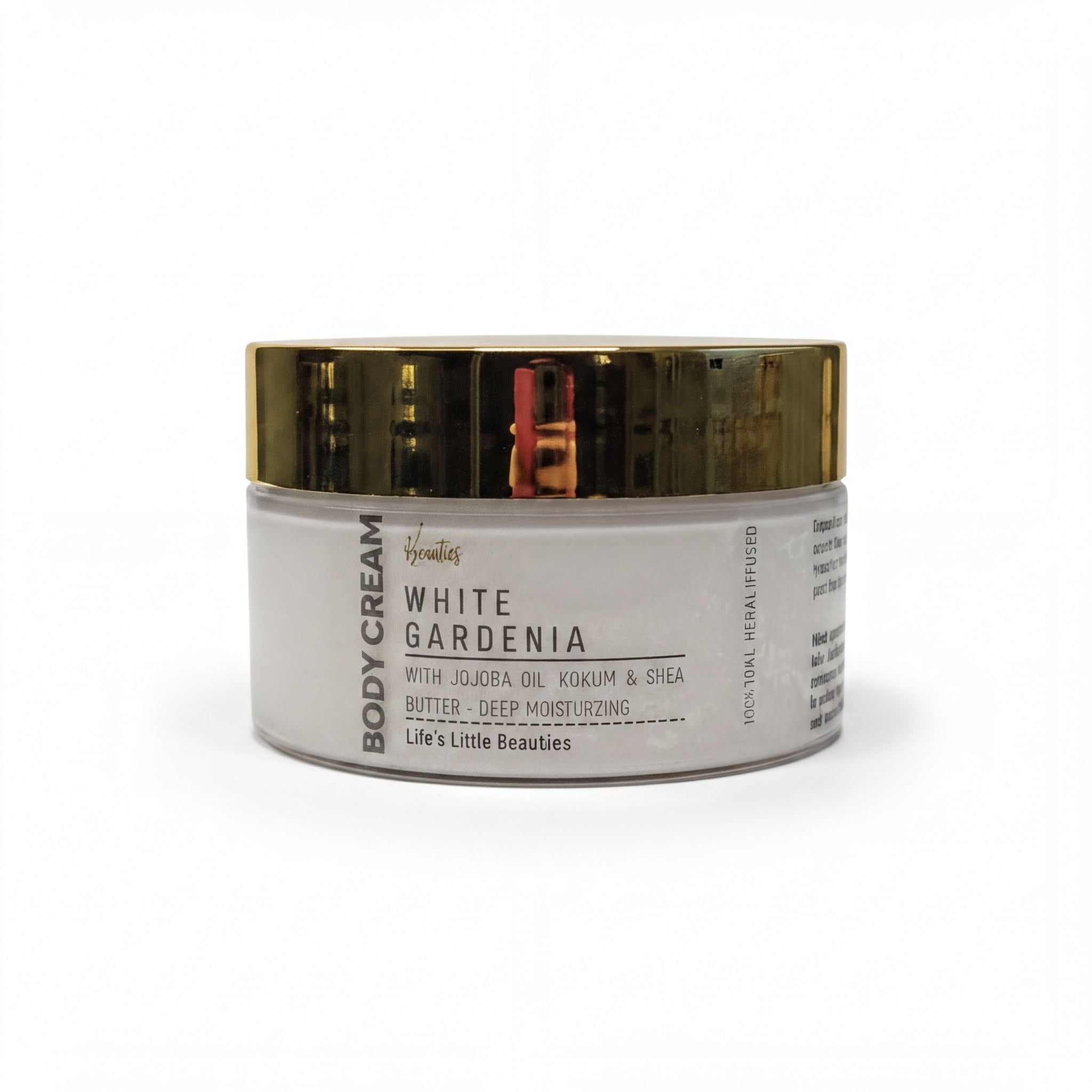 A jar of "White Gardenia Body Cream" with a gold lid, featuring a white label with black text.