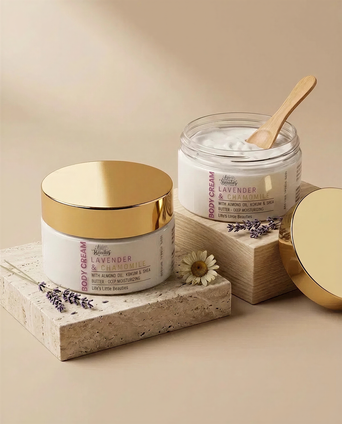 two jars of lavender and chamomile body cream, each with a gold lid and a wooden spoon, placed on a beige background.