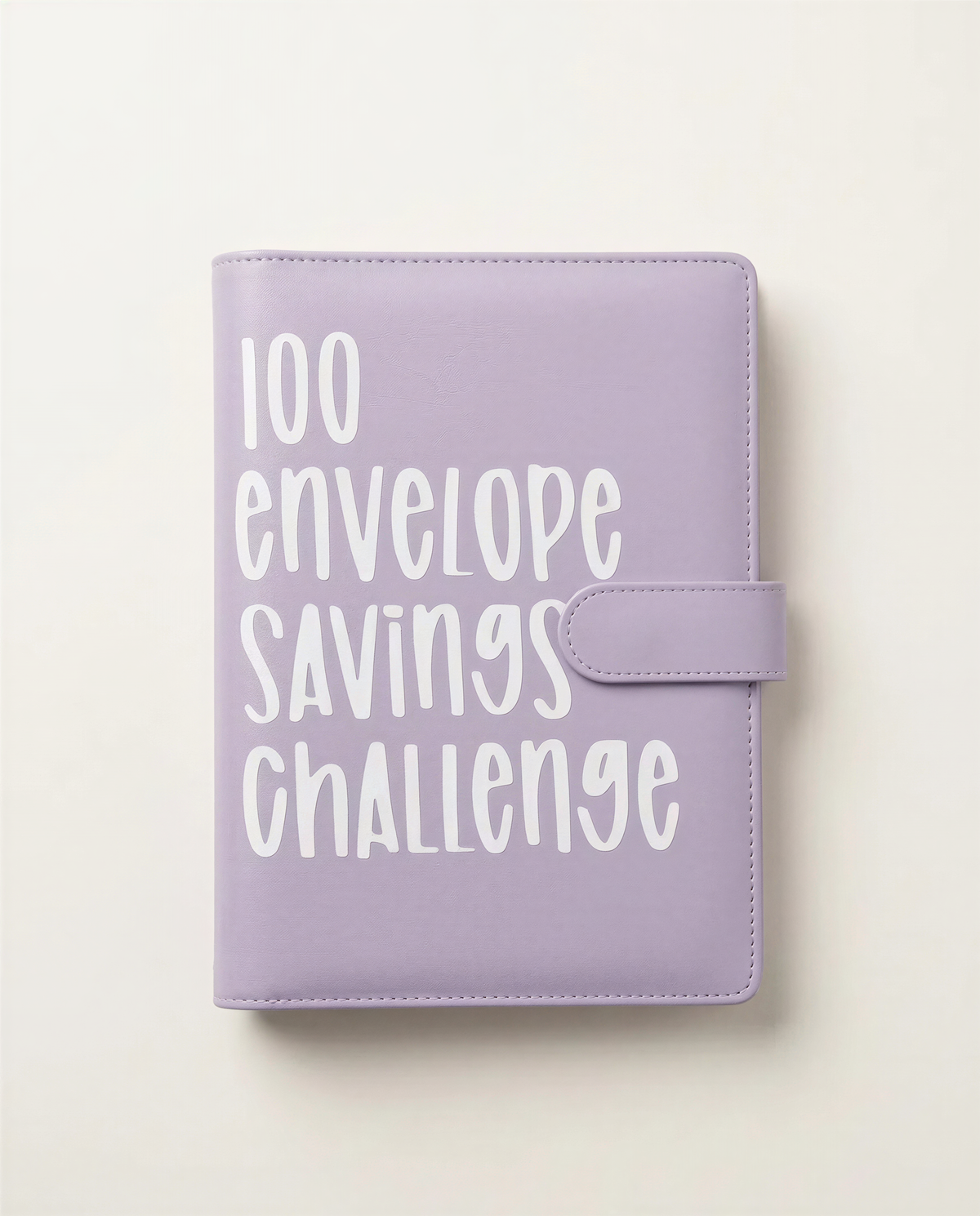 A purple notebook or binder with the text "100 envelope savings challenge" printed on it.