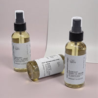 three bottles of body spray with labels that read "Midnight Berry & Cream" and "Post-Shower Body Spray".
