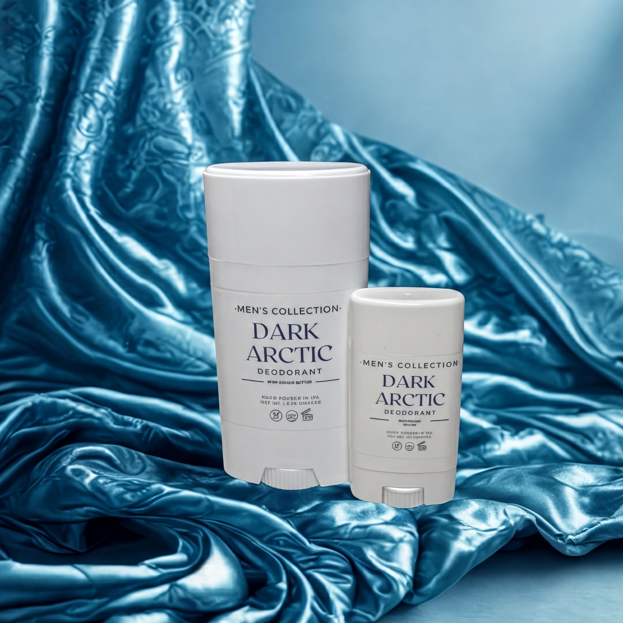 Two deodorant sticks from the "Dark Arctic Men's Collection" are displayed against a blue fabric background.