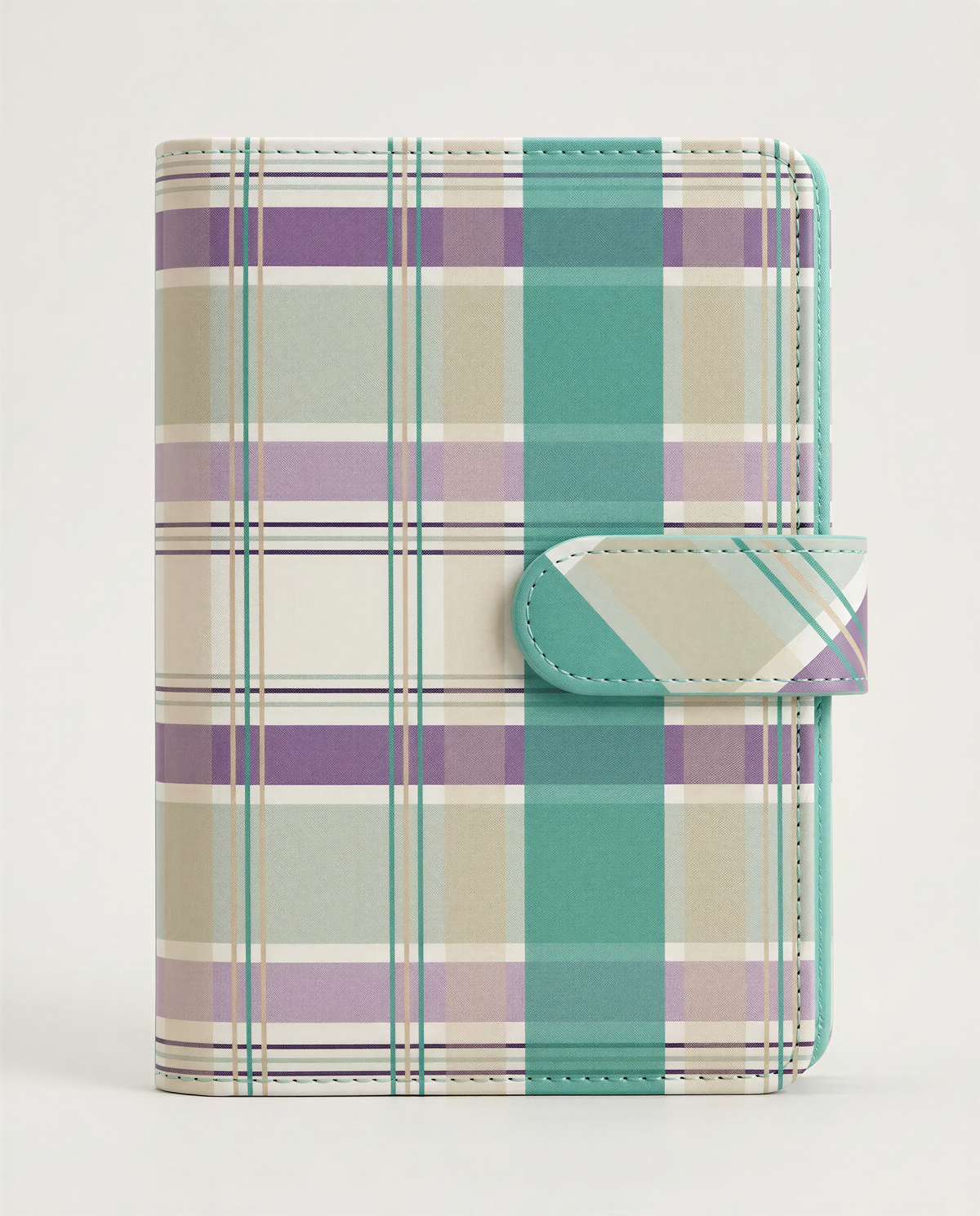 A colorful plaid wallet or card holder with a mint green and turquoise pattern.