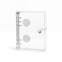A clear plastic binder with a metal ring mechanism and two circular holes on the front.