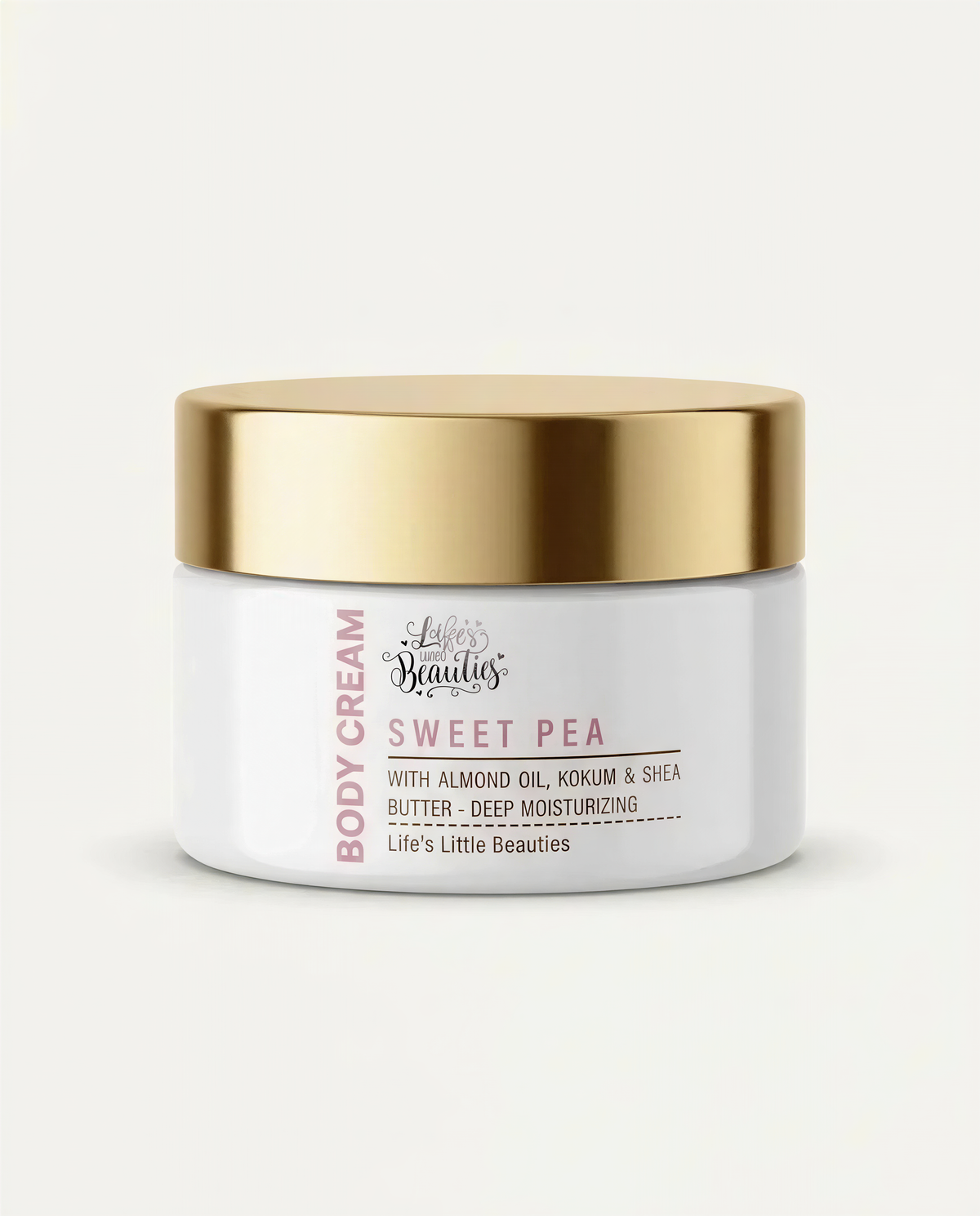 A jar of body cream with a gold lid, labeled as "Sweet Pea" and containing almond oil, shea butter, and deep moisturizing ingredients.