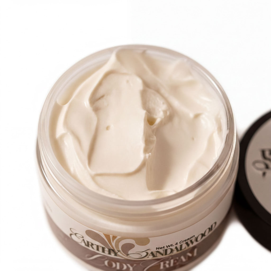 A jar of body cream with a white, creamy texture and a label that reads "Earthy Sandalwood".