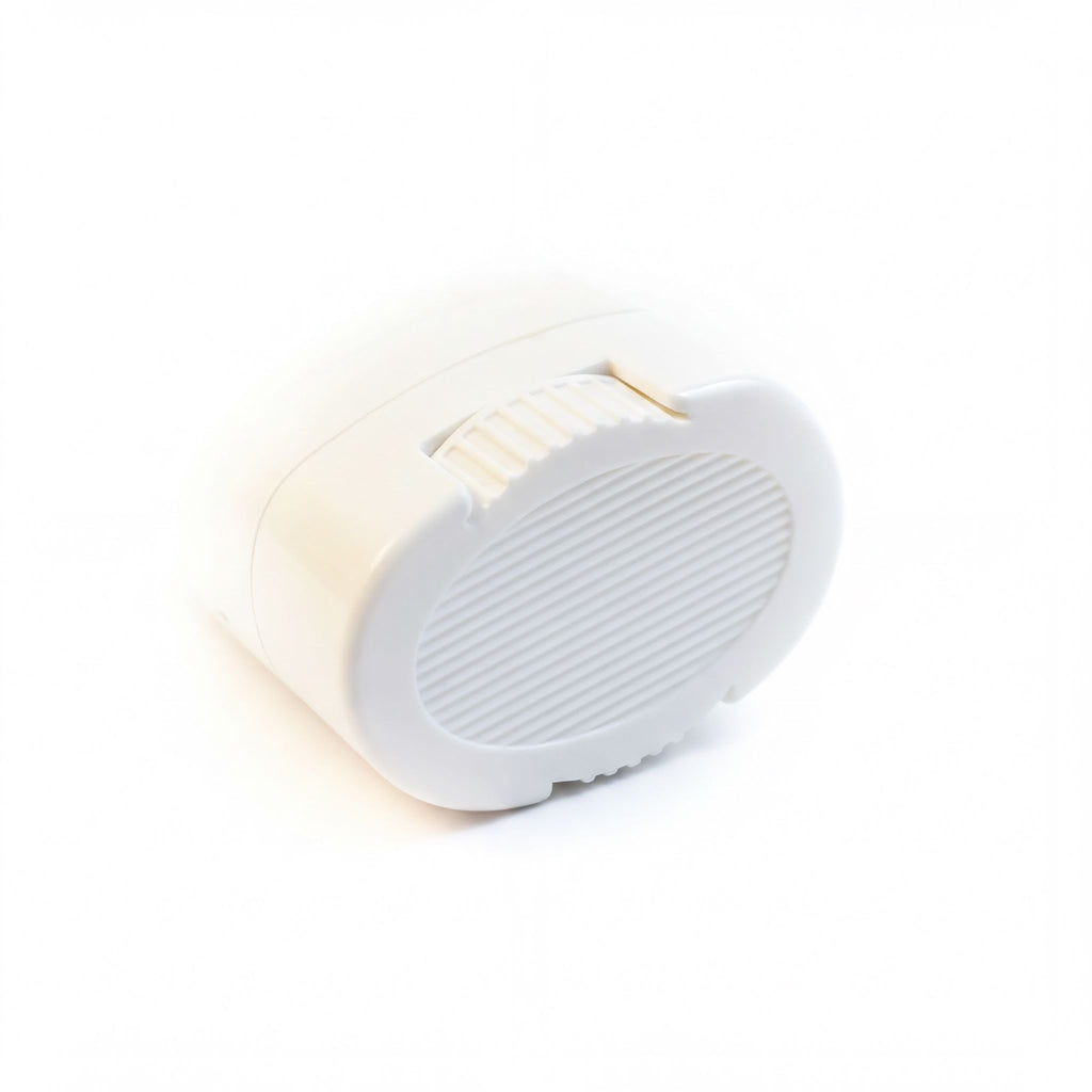 A white oval-shaped object with a textured surface, possibly a container or lid, is shown against a white background.