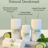 three cucumber deodorant sticks arranged on a marble surface, with sliced cucumbers and mint leaves nearby.