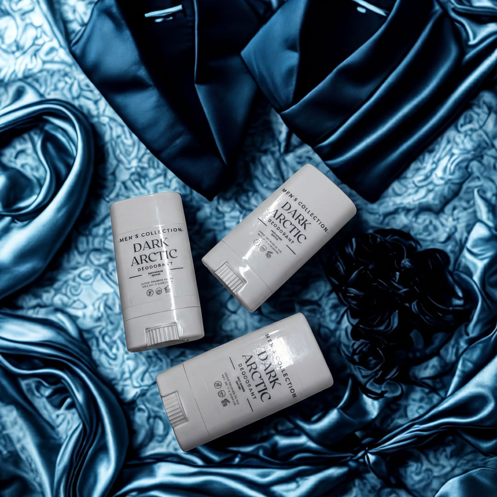 Three men's deodorant sticks from the "Men's Collection" are arranged on a blue fabric background.