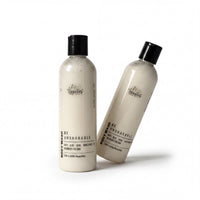 Two bottles of body wash with a white color and black cap, labeled as unshaakable.