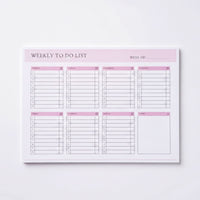 a pink and white weekly to-do list with a blank space for notes, placed on a white background.
