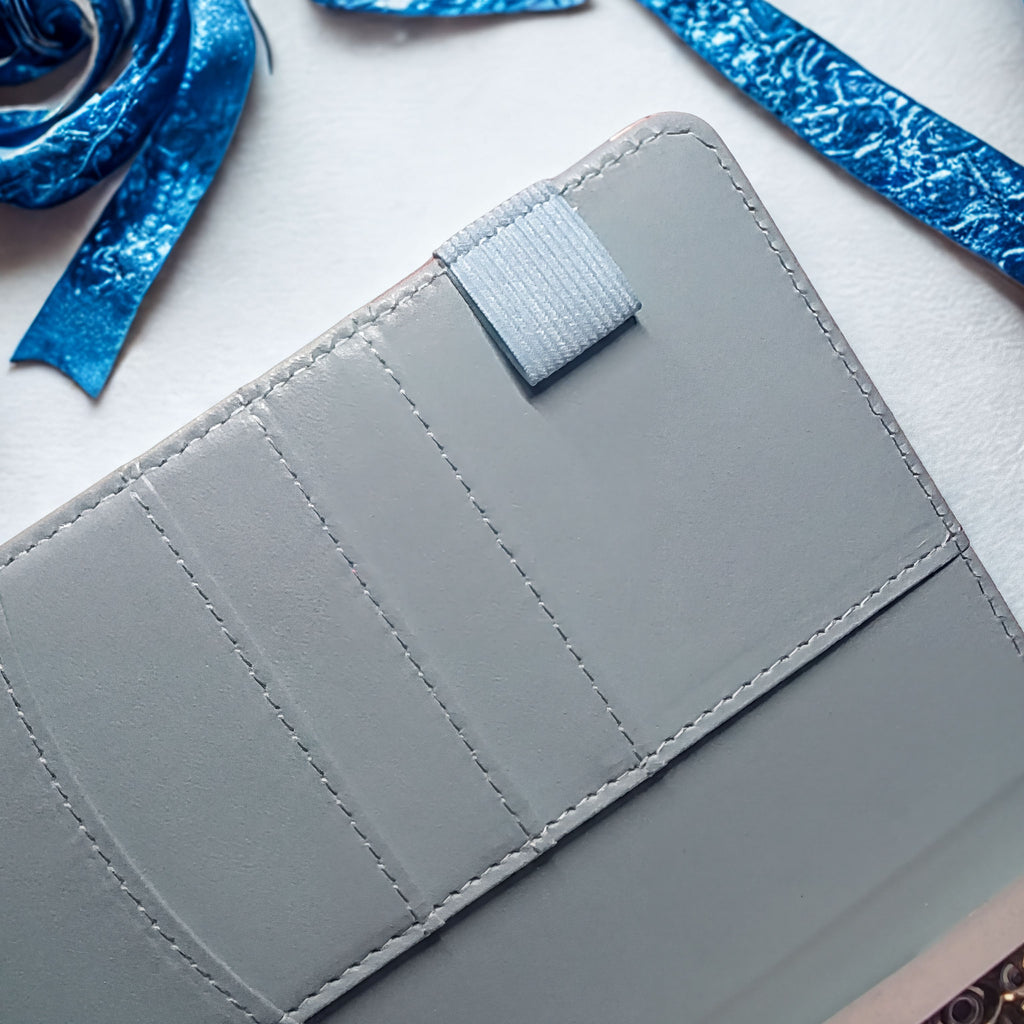 Gray leather wallet with card slots and blue velvet ribbon, handcrafted with natural materials