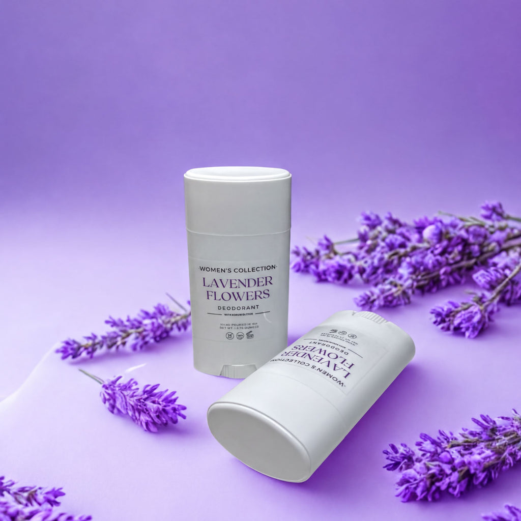 two white deodorant sticks with purple text, one upright and one lying on its side, surrounded by purple flowers against a purple background.