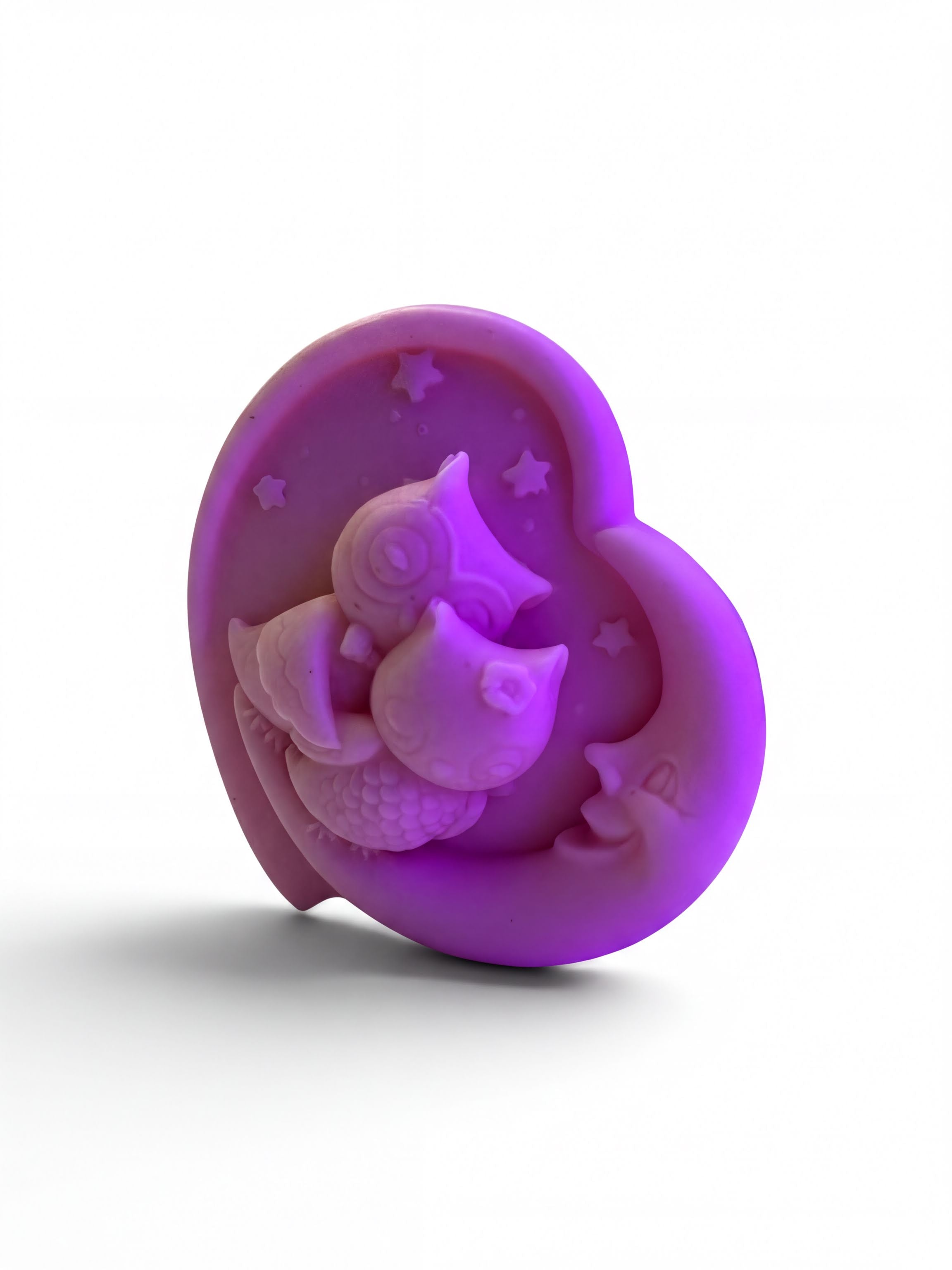 A purple owl figurine is depicted in a heart shape, with a crescent moon and stars around it.