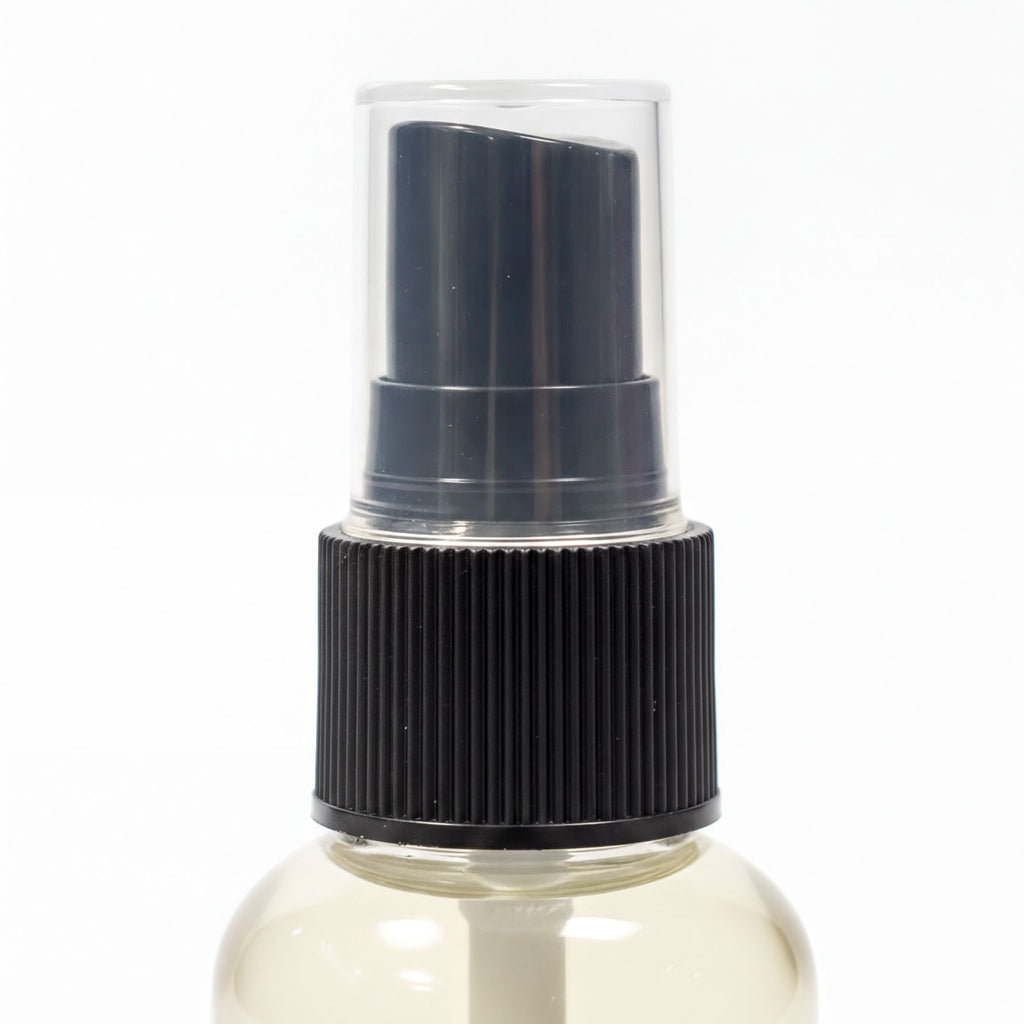 A spray bottle with a black pump and a black cap.