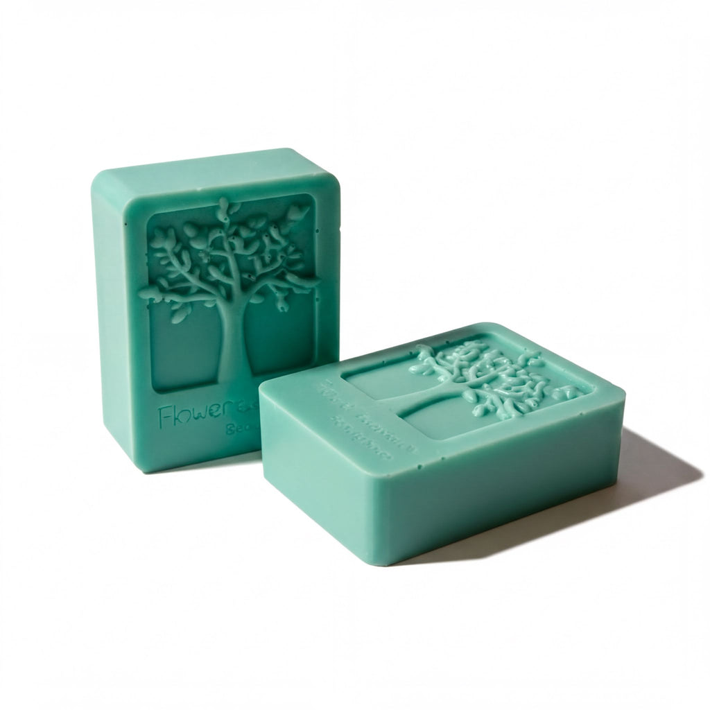 Two green rectangular bars with tree designs on them, placed side by side against a white background.
