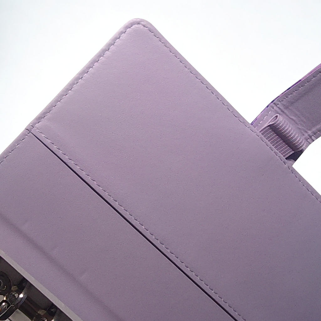 Lavender vegan leather clutch with precise stitching and magnetic closure detail