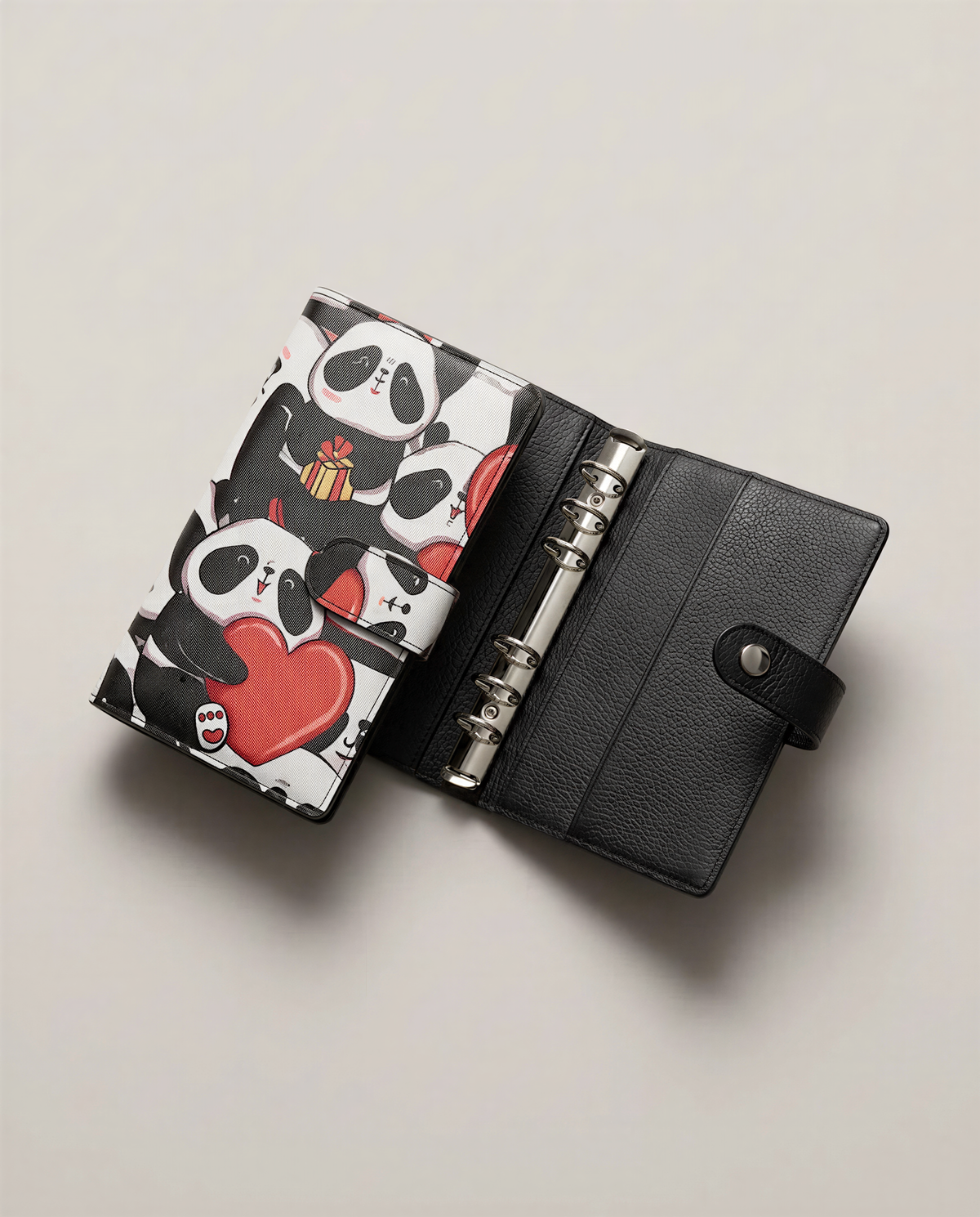 A black leather wallet or money holder with a panda design printed on it, placed on a plain background.