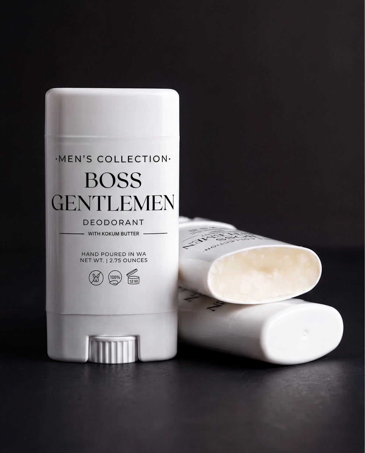 A white deodorant stick labeled "Men's Collection: Boss Gentlemen Deodorant" with a black background.