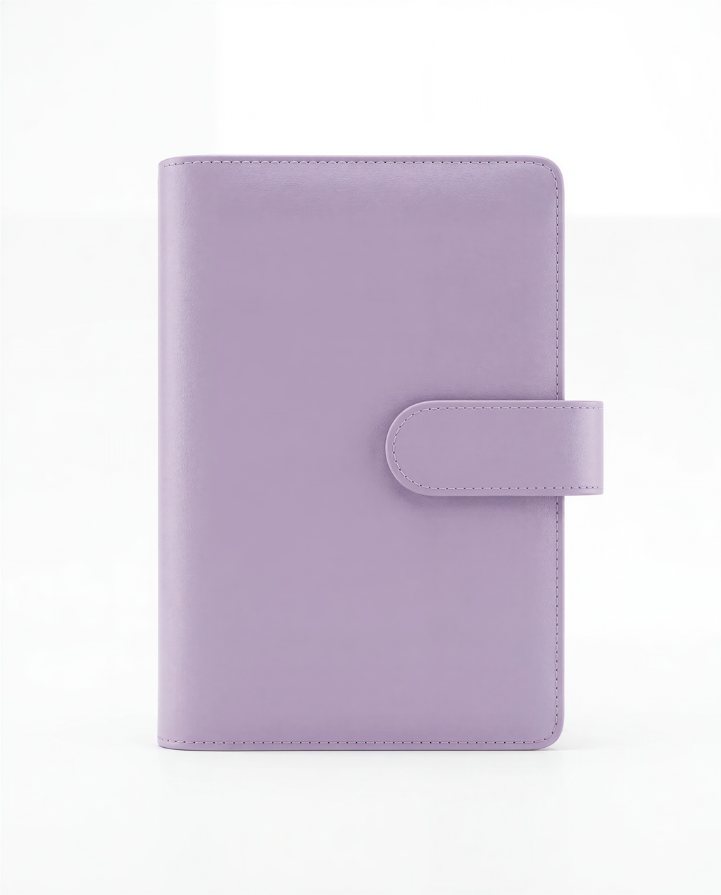 A purple leather-bound notebook or planner with a small clip on the front.