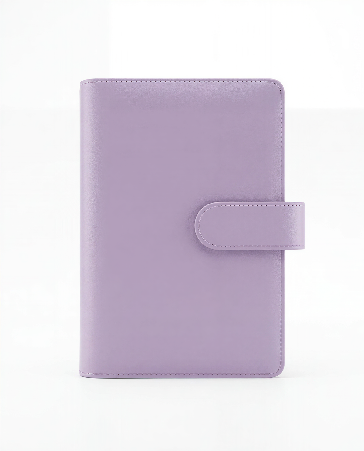 A purple leather-bound notebook or planner with a small clip on the front.
